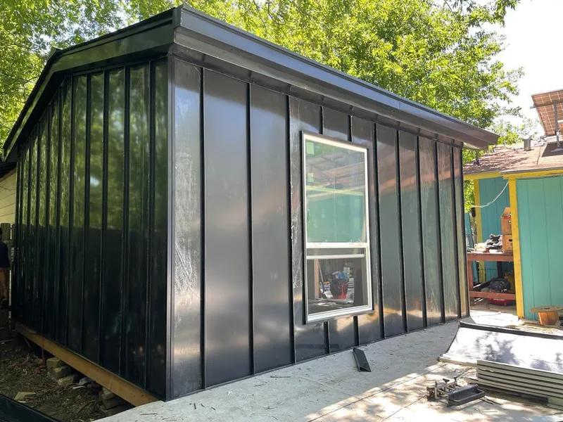 Black standing seam metal wall panels for Metal Roof Installation in East Riverdale