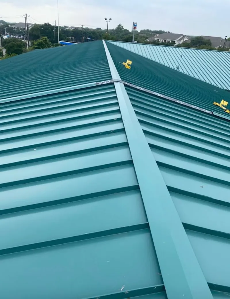 Green commercial metal roof ridge and valley for Metal Roof Repair in East Riverdale